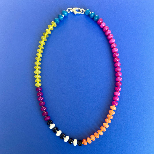 A colorful necklace with 8mm jade, onyx, and chalcedony gemstones, accented with bold Czech glass beads and a premium clasp.