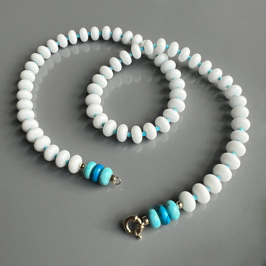 A modern design blending white onyx gemstones with vibrant turquoise accents, perfect for layering or wearing solo.