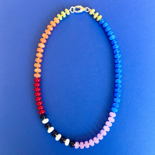 Handcrafted necklace with colorful gemstones and a premium sterling silver clasp.