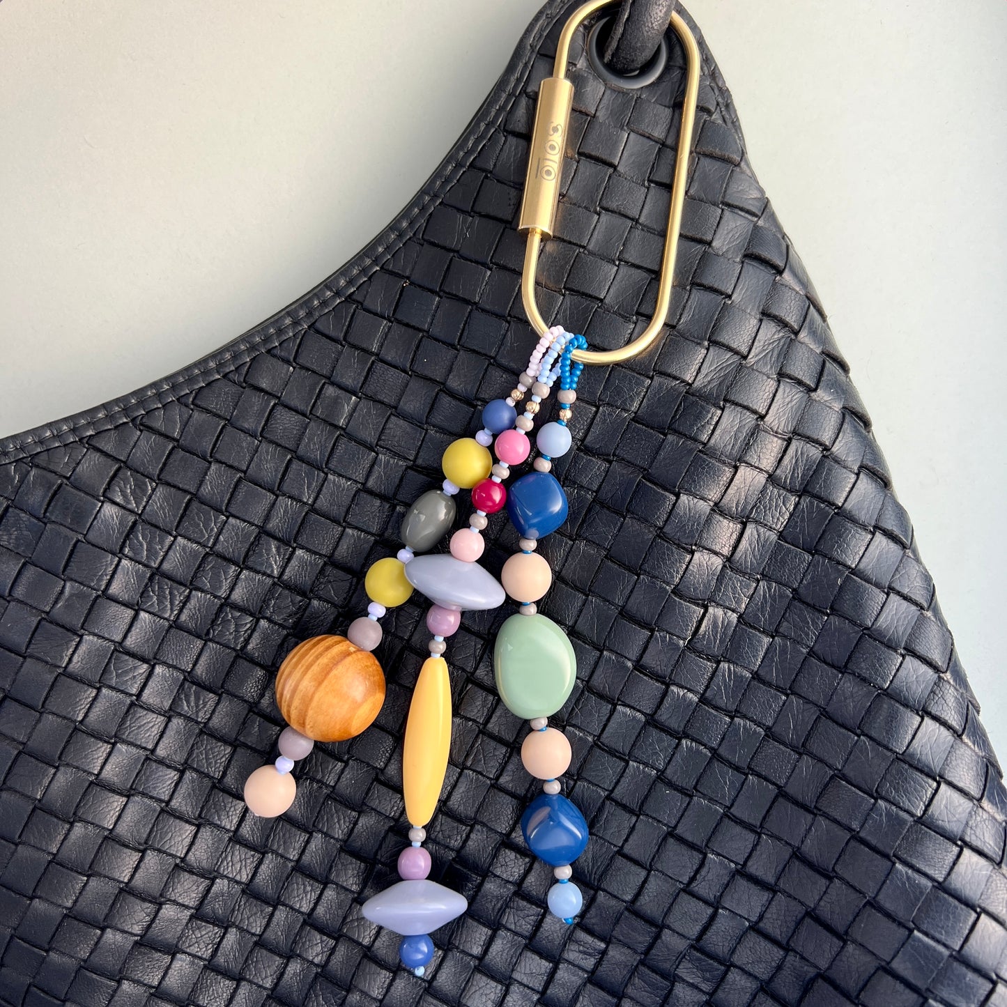 Handcrafted beads including vibrant Czech glass, wooden, and vintage acrylic for a distinctive, tactile design.