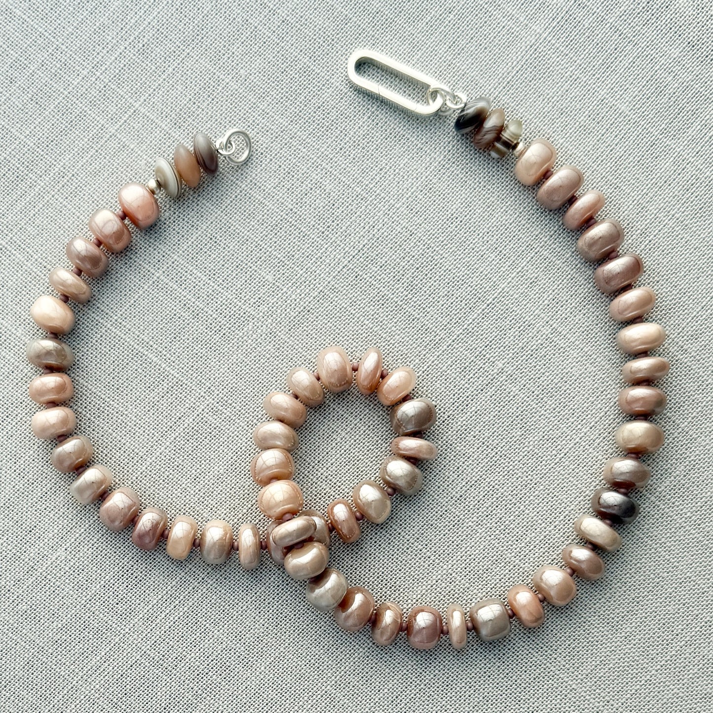 Moonstone and agate gemstone necklace with a premium clasp, ideal for layering or adding a touch of sophistication to any look.