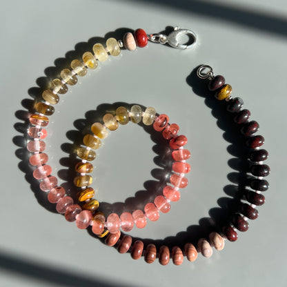 A handcrafted Desert Rose Necklace featuring rhodonite, jasper, quartz, and coral gemstones, finished with a 14k gold or sterling silver clasp. 