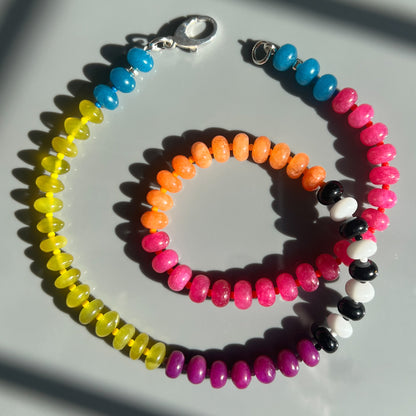 A unique, handcrafted necklace made with jade, onyx, chalcedony, and Czech glass beads, adding a fun burst of color to any outfit.