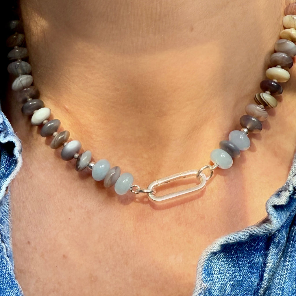 Featuring Botswana agate and chalcedony gemstones, this beaded necklace is perfect for layering or wearing solo, with a customizable clasp for your favorite charm.