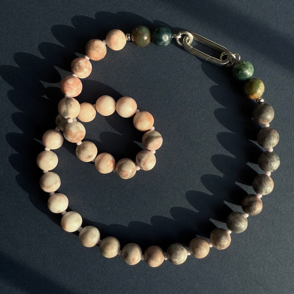 This handmade Eclipse Natural Gemstone Beaded Necklace features handpicked Agate and Jasper, with a 14K gold or sterling silver clasp, perfect for layering or wearing solo.