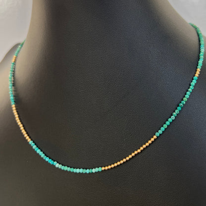 Versatile turquoise and 14K gold bead necklace, featuring faceted gemstones for a vibrant and elegant addition to your jewelry collection.