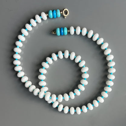 A chic necklace featuring white onyx, turquoise, and howlite beads, with a choice of 14k gold or sterling silver clasp.