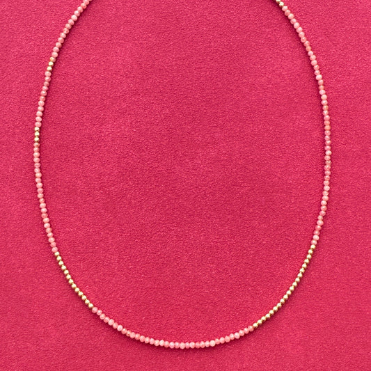 Delicate rhodonite and 14K gold bead strand necklace, crafted to add chic elegance to any look, perfect for layering or wearing solo.