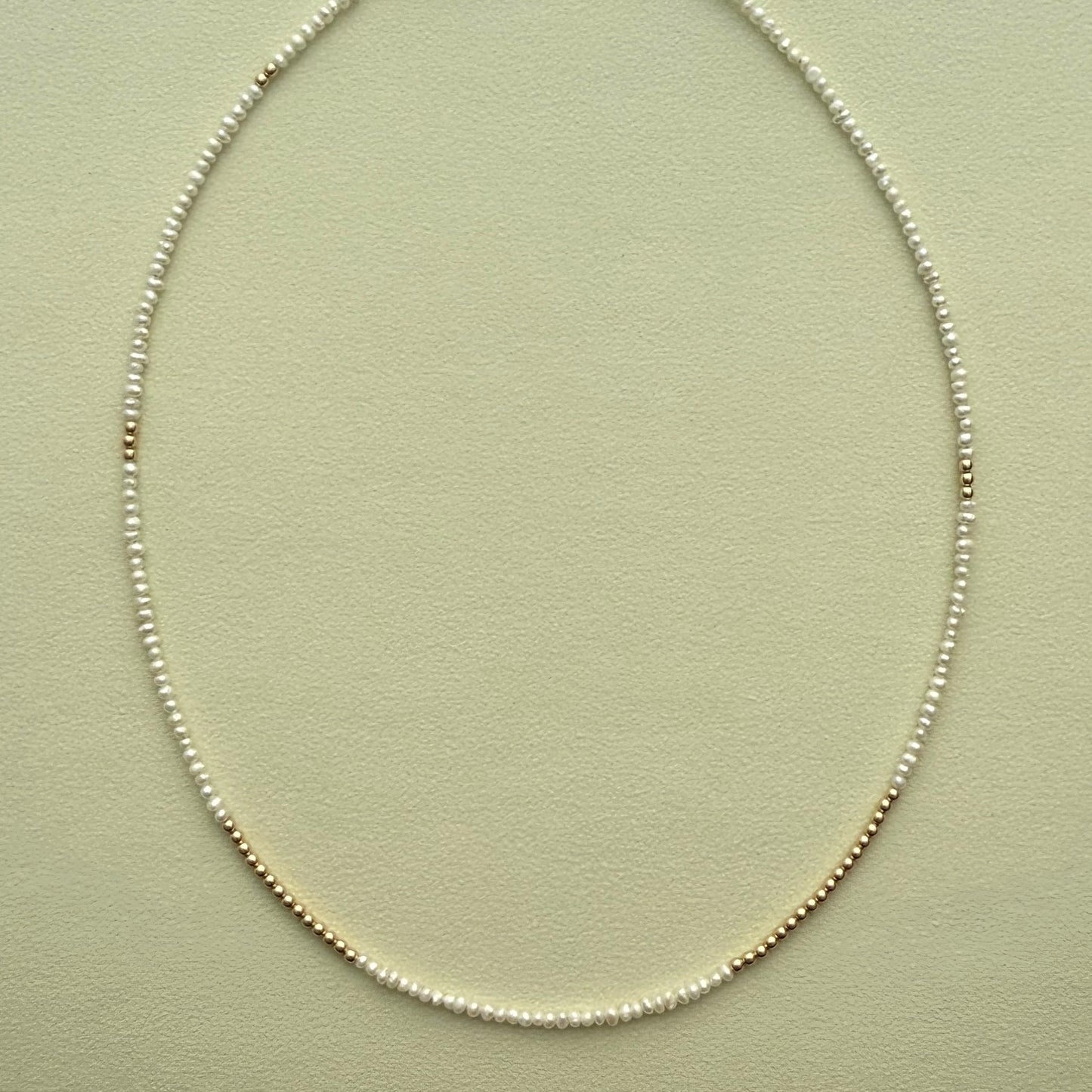 strand necklace : 14k gold + pearls