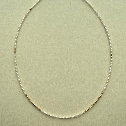 strand necklace : 14k gold + pearls
