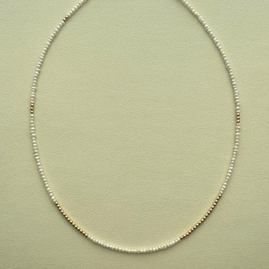 strand necklace : 14k gold + pearls