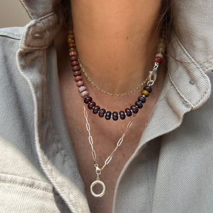 A close-up of the Desert Rose Necklace, featuring vibrant rhodonite, jasper, quartz, and coral gemstones, styled with a premium clasp for an elegant layered look.