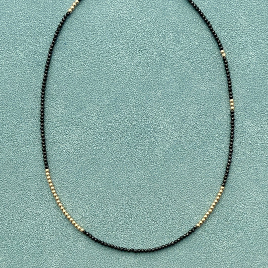 strand necklace : 14k gold + black spinel