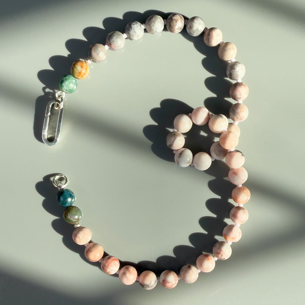 Elevate your style with the Eclipse Natural Gemstone Beaded Necklace, showcasing Agate and Jasper stones, with a customizable clasp and the option to add your favorite charm.