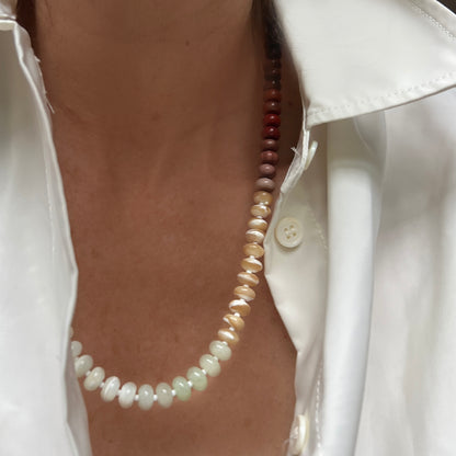 A neutral yet elegant necklace made with mother of pearl, onyx, chalcedony, and Czech glass beads, perfect for adding sophistication to any outfit.