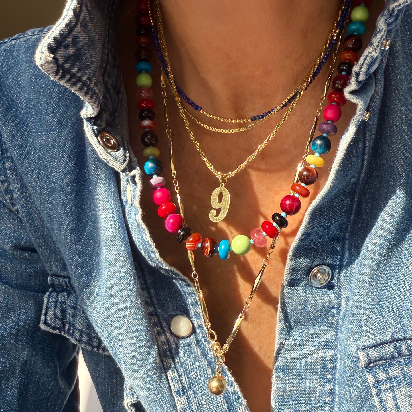CALYPSO : green turquoise, black onyx, opal, tiger's eye, carnelian, jasper, chalcedony, howlite, red coral, celite and quartz