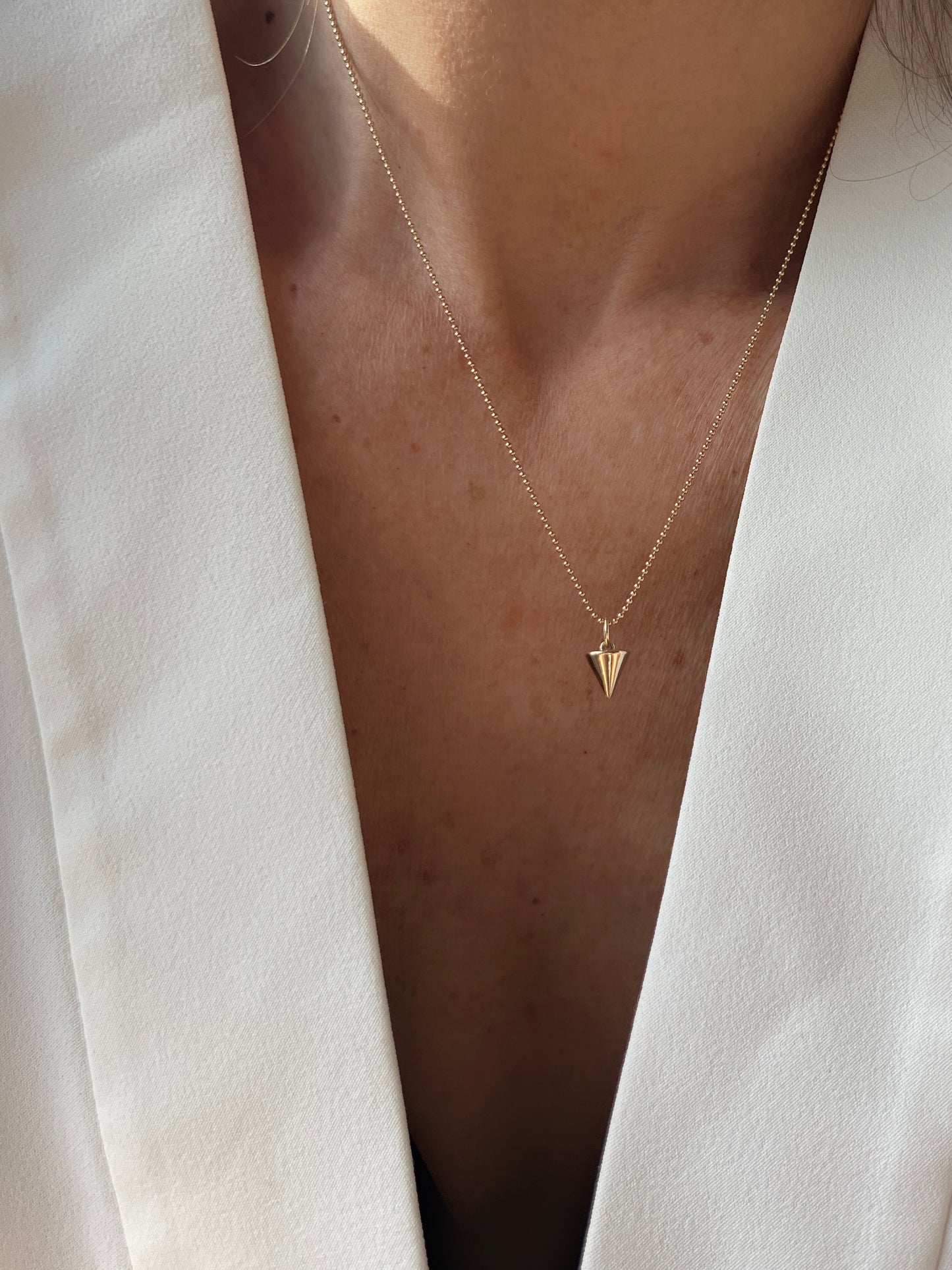 With a meaningful triangular charm, the Zenith Petite Necklace represents unity, growth, and balance. Handcrafted in NYC, it’s available in 14K gold or sterling silver for lasting elegance.