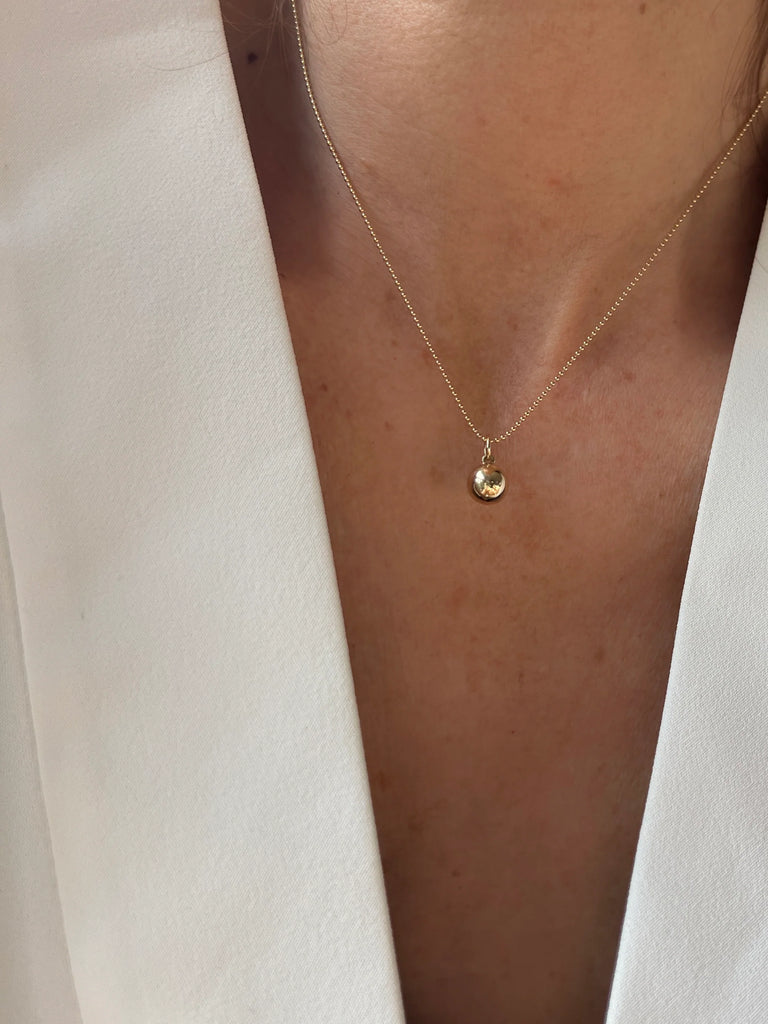 A symbol of connection and harmony, the 14K Gold Sphere Pendant embodies wholeness and elegance, perfect for everyday wear.