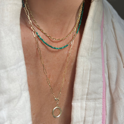 Elegant malachite and 14K gold bead strand, showcasing natural variations in gemstone hues for a unique, one-of-a-kind accessory.