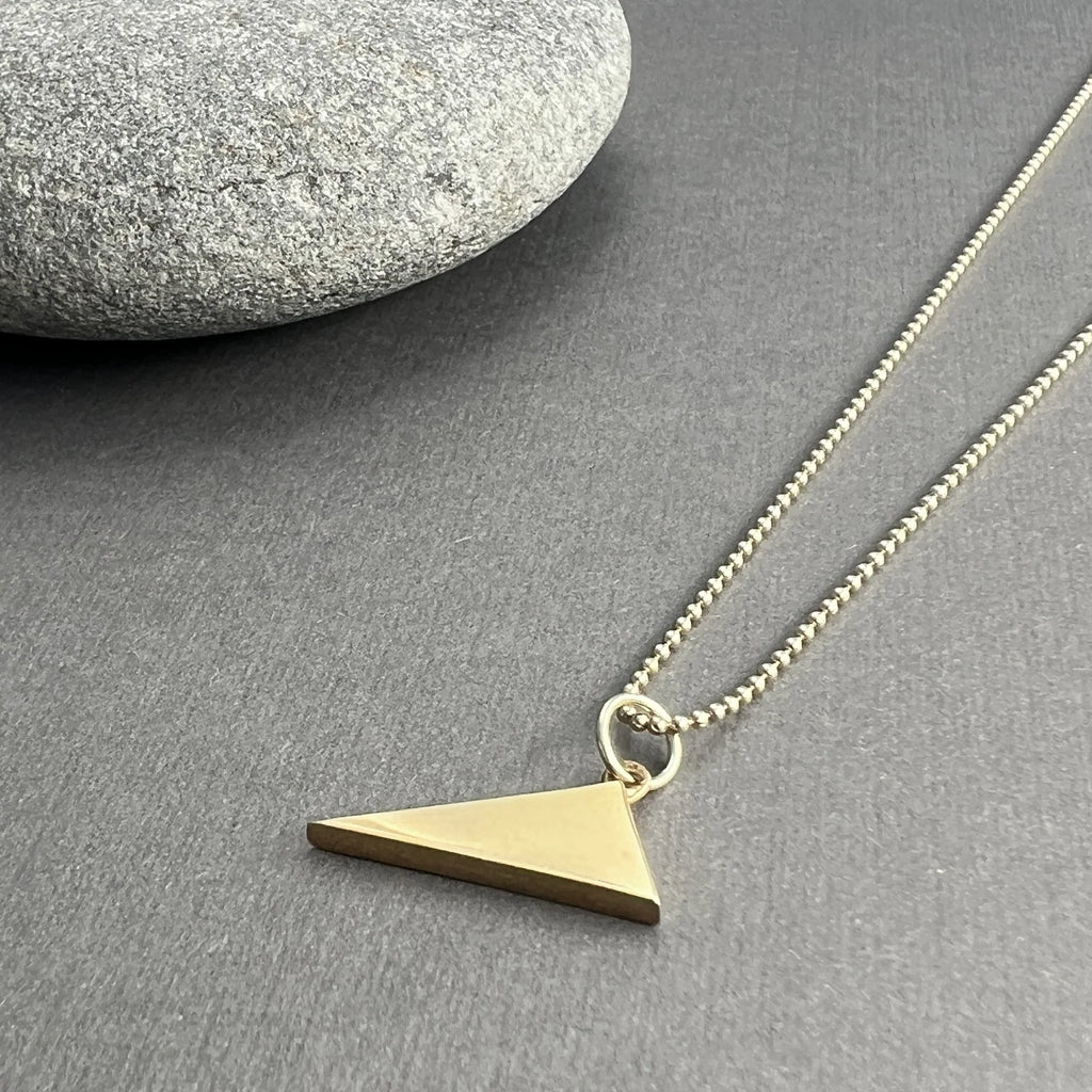 The Scalene Triangle Pendant, with its asymmetrical design, celebrates individuality and authenticity, crafted from solid 14K gold or sterling silver.