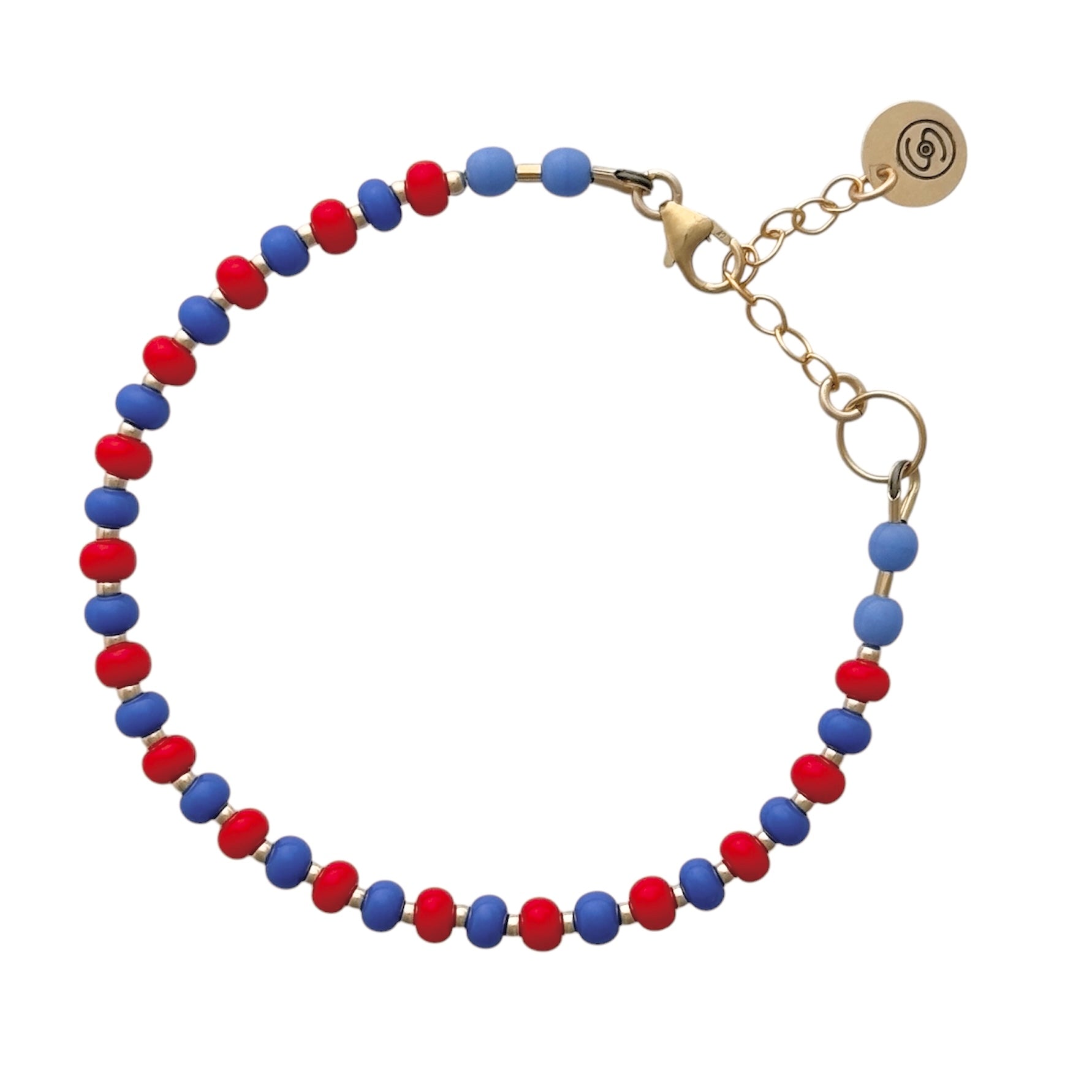 Hand-strung with high-quality Czech glass beads, the Periwinkle + Red HAPPY Bracelet adds a playful yet elegant touch to any outfit.