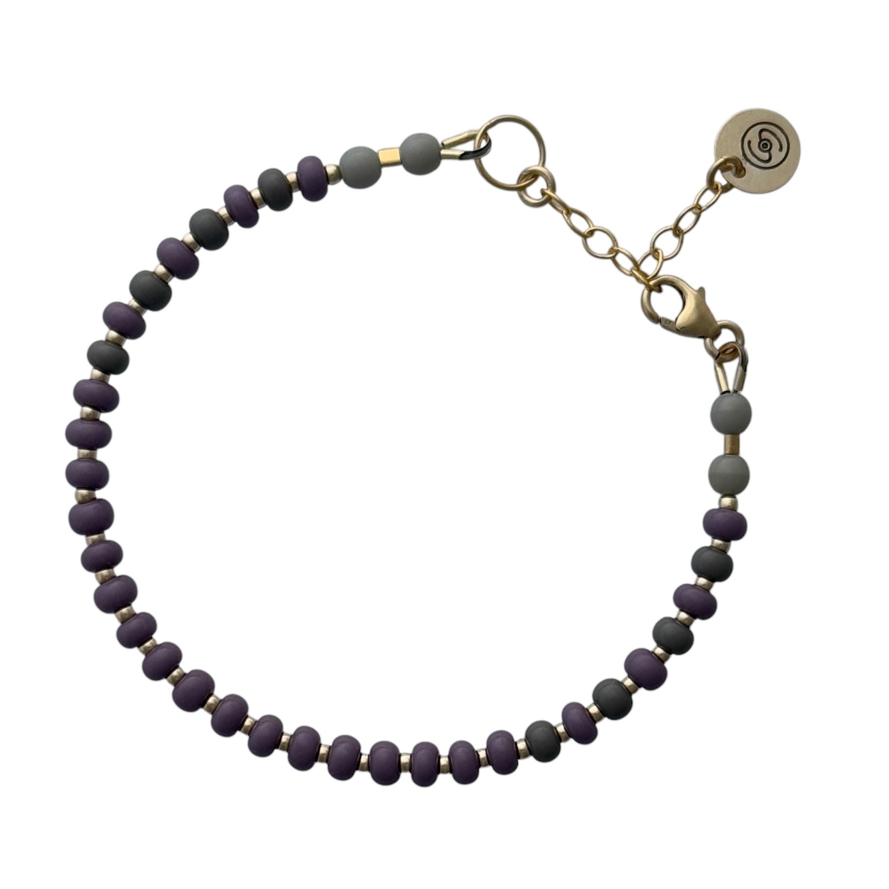 Elegant and versatile, this handcrafted Midnight Black + Gray HAPPY Bracelet blends neutral tones with shimmering gold-filled accents for a sophisticated look.