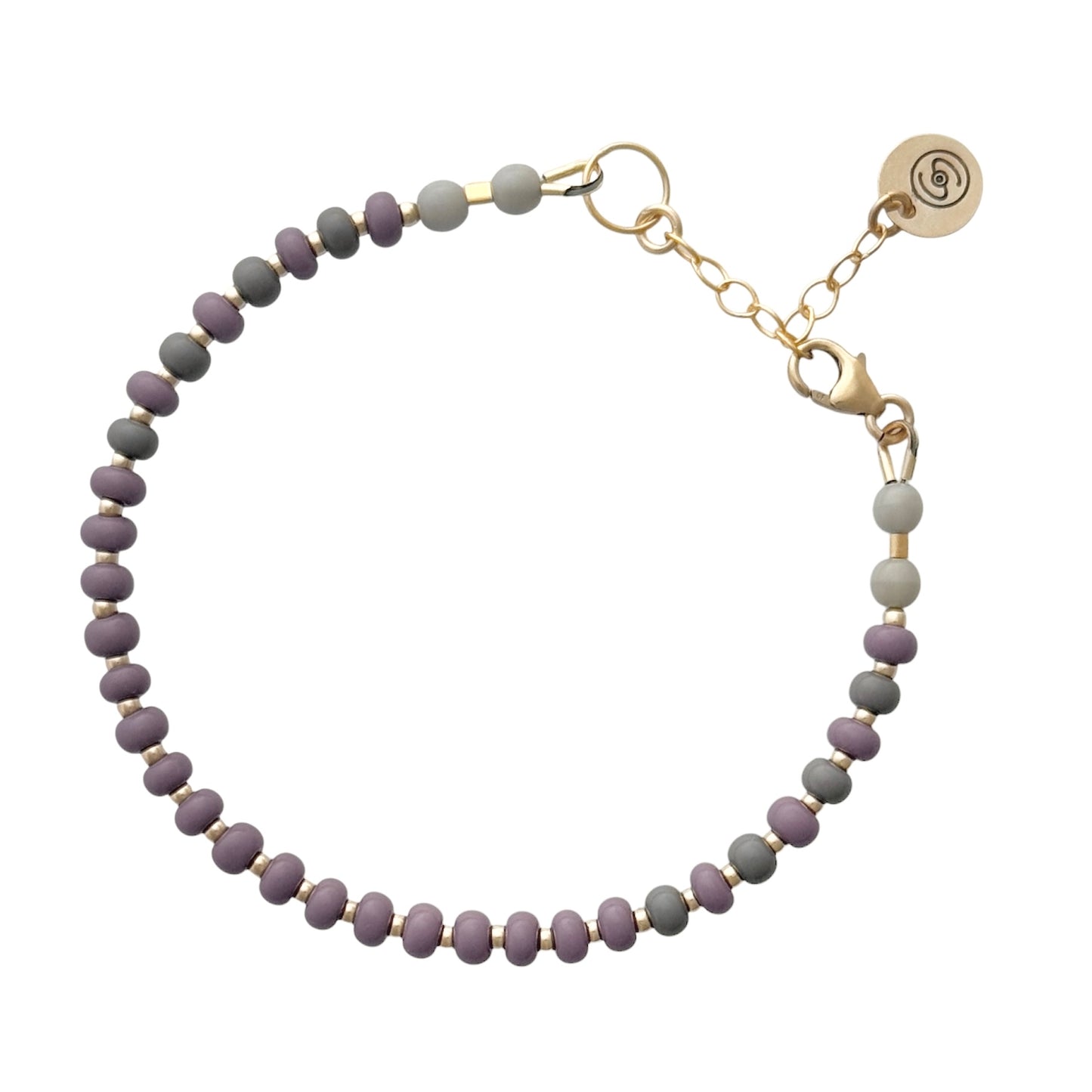 Subtle and sophisticated, the Soft Shadows HAPPY Bracelet combines soft-toned glass beads with tarnish-resistant gold-filled details for effortless everyday wear.