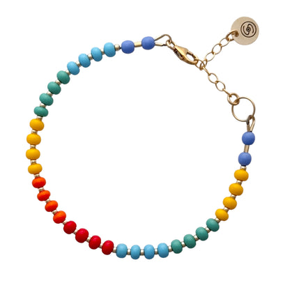 Bright and cheerful, this handcrafted Rainbow HAPPY Bracelet showcases a mix of multicolored Czech glass beads with luxurious gold-filled details.