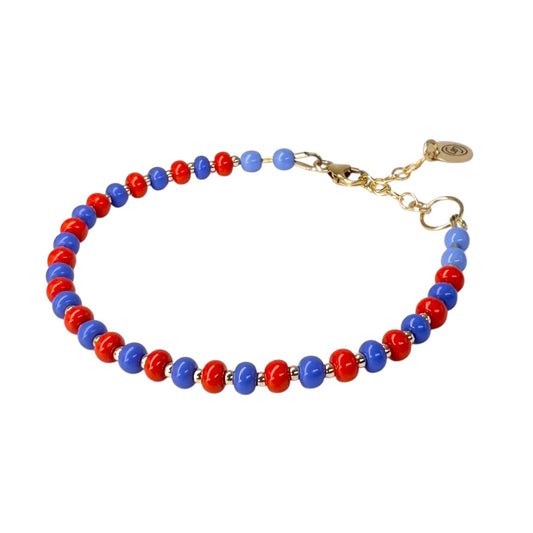 The Periwinkle + Red HAPPY Bracelet features a vibrant mix of bold red and soft periwinkle Czech glass beads, accented with 14K gold-filled details.