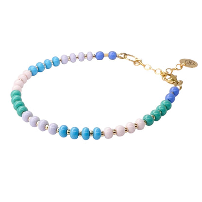The Pastel HAPPY Bracelet features soft-hued Czech glass beads with 14K gold-filled accents, creating a delicate and elegant everyday accessory.