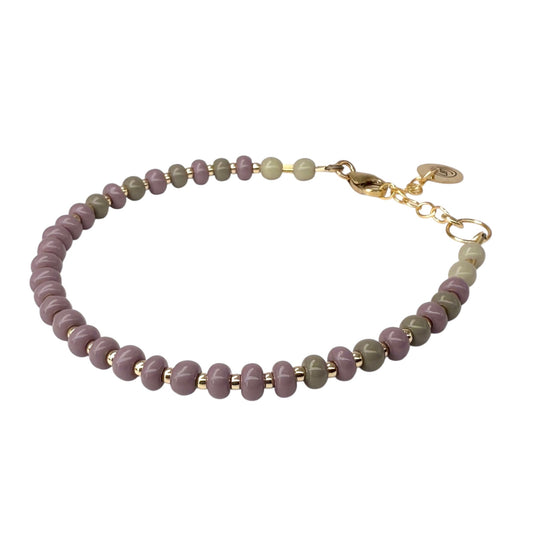 The Soft Shadows HAPPY Bracelet features a delicate blend of muted Czech glass beads with 14K gold-filled accents, creating an elegant and timeless look.