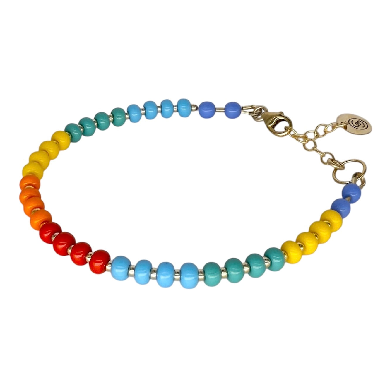 The Rainbow HAPPY Bracelet features vibrant Czech glass beads and 14K gold-filled accents, creating a playful and colorful statement piece.