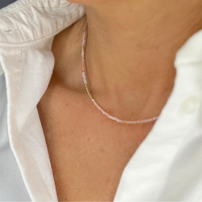 Delicate pink opal and 14K gold necklace with lobster clasp closure, ideal for both standalone sophistication and layered chicness.