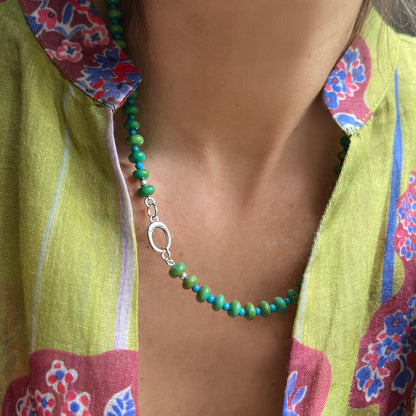 A handcrafted necklace showcasing alternating turquoise and green beads, creating a refreshing and natural aesthetic.