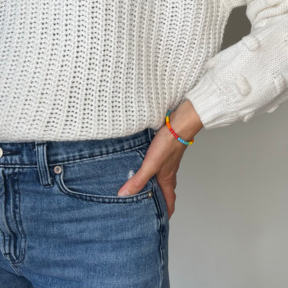 Add a burst of color to your jewelry collection with the Rainbow HAPPY Bracelet, designed with high-quality Czech glass beads and radiant gold-filled touches.