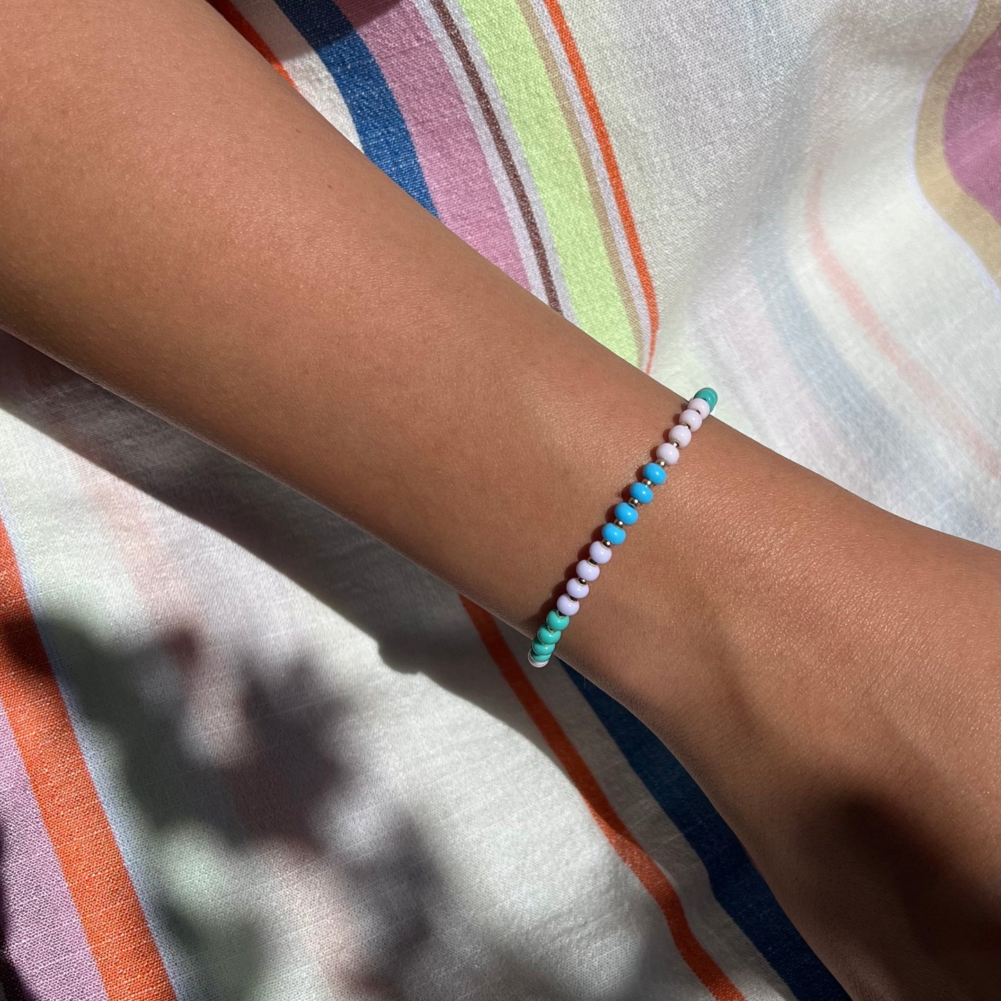 Handcrafted with pastel Czech glass beads and gold-filled details, this bracelet adds a subtle pop of color while remaining timeless and versatile.