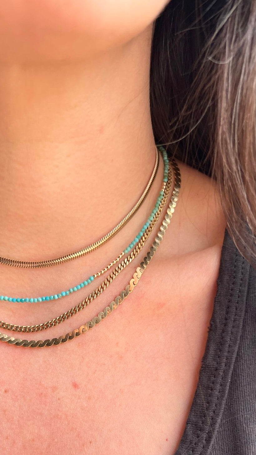 Delicate turquoise gemstones and 14K gold beads, creating a timeless necklace that can be worn solo or layered for a fashion-forward look.