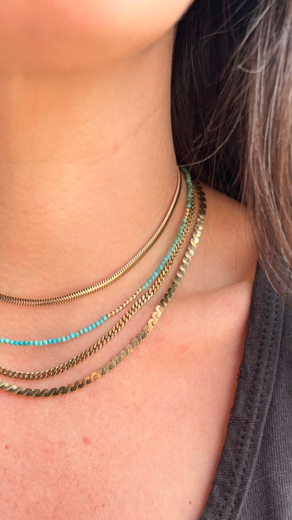 Delicate turquoise gemstones and 14K gold beads, creating a timeless necklace that can be worn solo or layered for a fashion-forward look.
